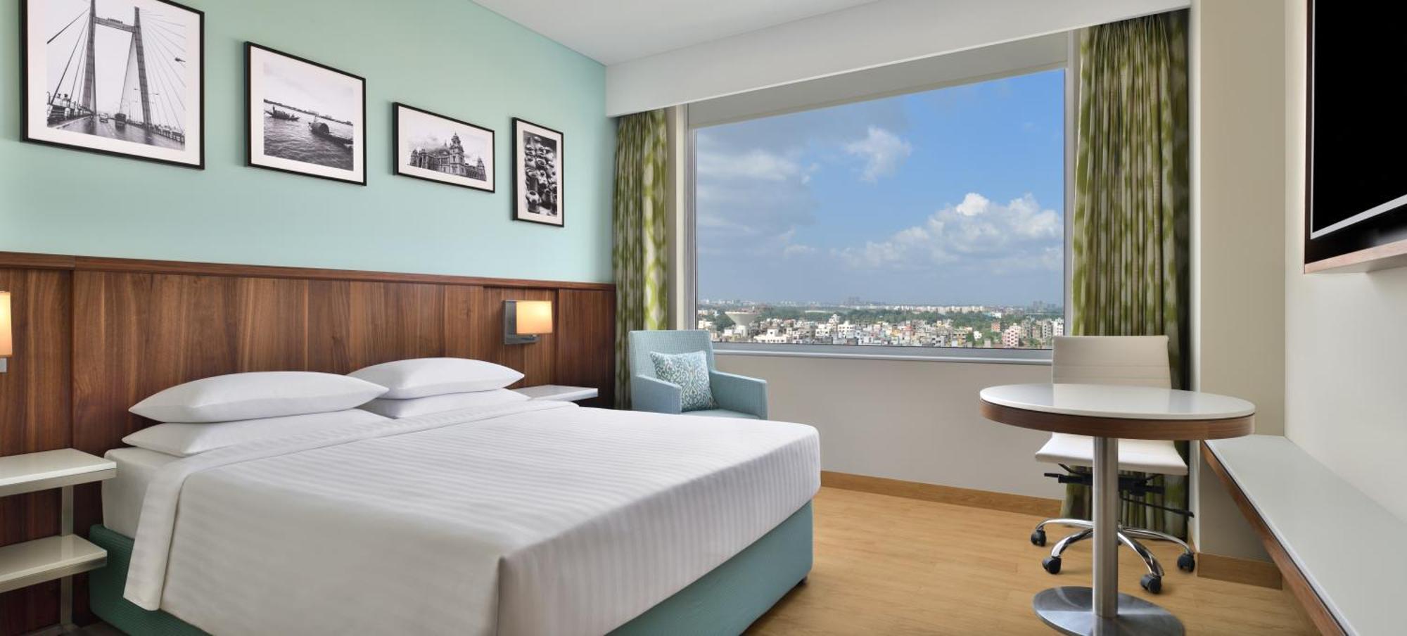 Executive Queen Room One-way airport transfer & INR 1000 Hotel Credit per Happy Hours 11 IMFL 4 PM to 8 PM at Vertex