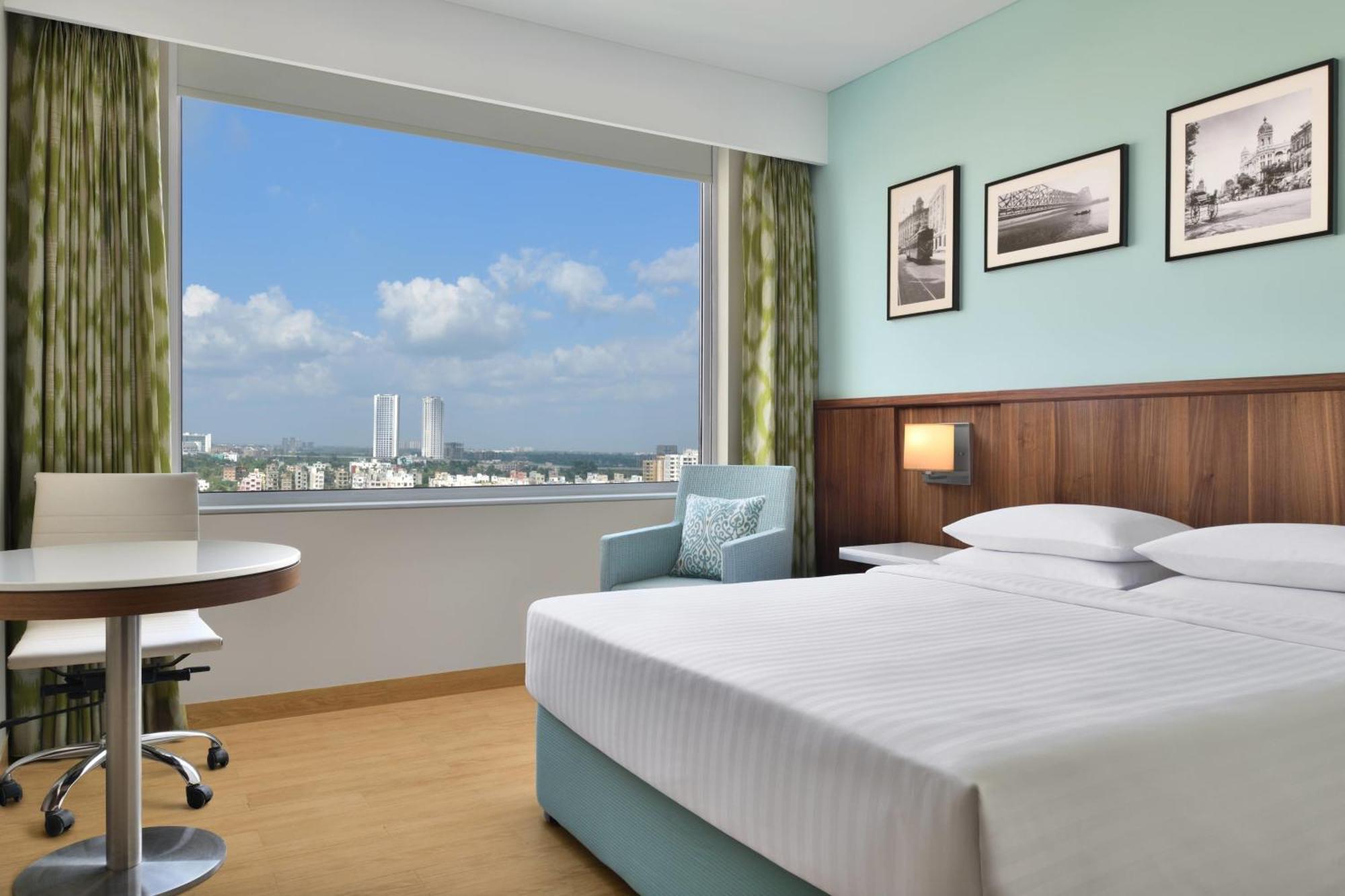 Executive Queen Room One-way airport transfer & INR 1000 Hotel Credit per Happy Hours 11 IMFL 4 PM to 8 PM at Vertex