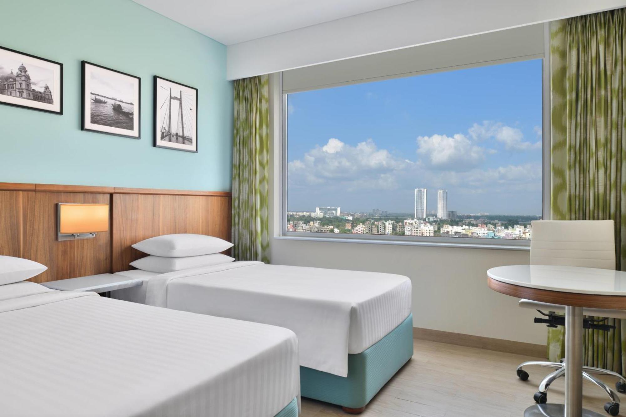 Executive Twin Room One-way airport transfer & INR 1000 Hotel Credit per Happy Hours 11 IMFL 4 PM to 8 PM at Vertex