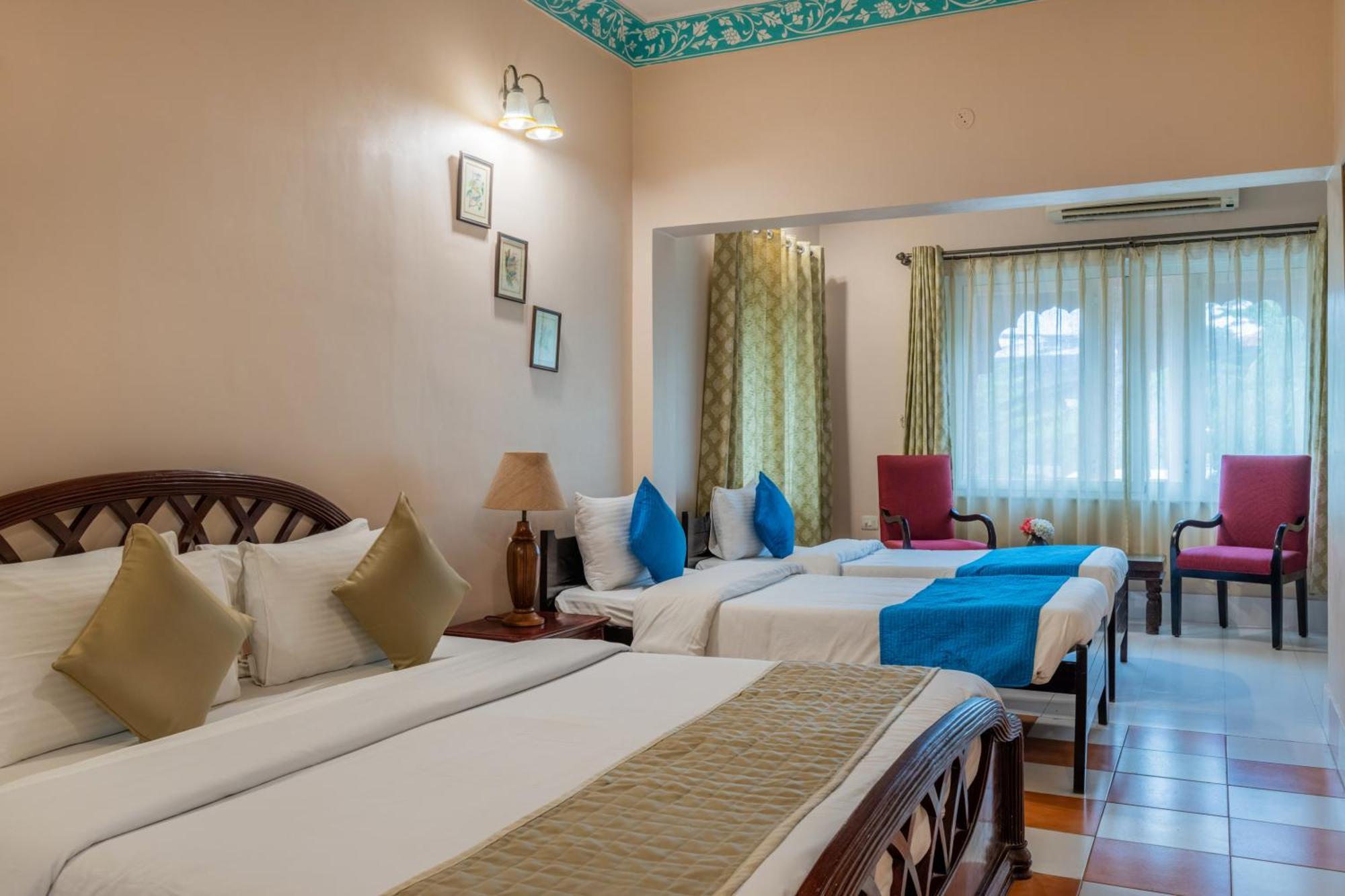 Classic Quadruple Room -  Includes free pickup from airport/ train station / bus station via tuk-tuk, & a dedicated travel desk to assist with local sightseeing tours, intercity travel arrangements & activities.