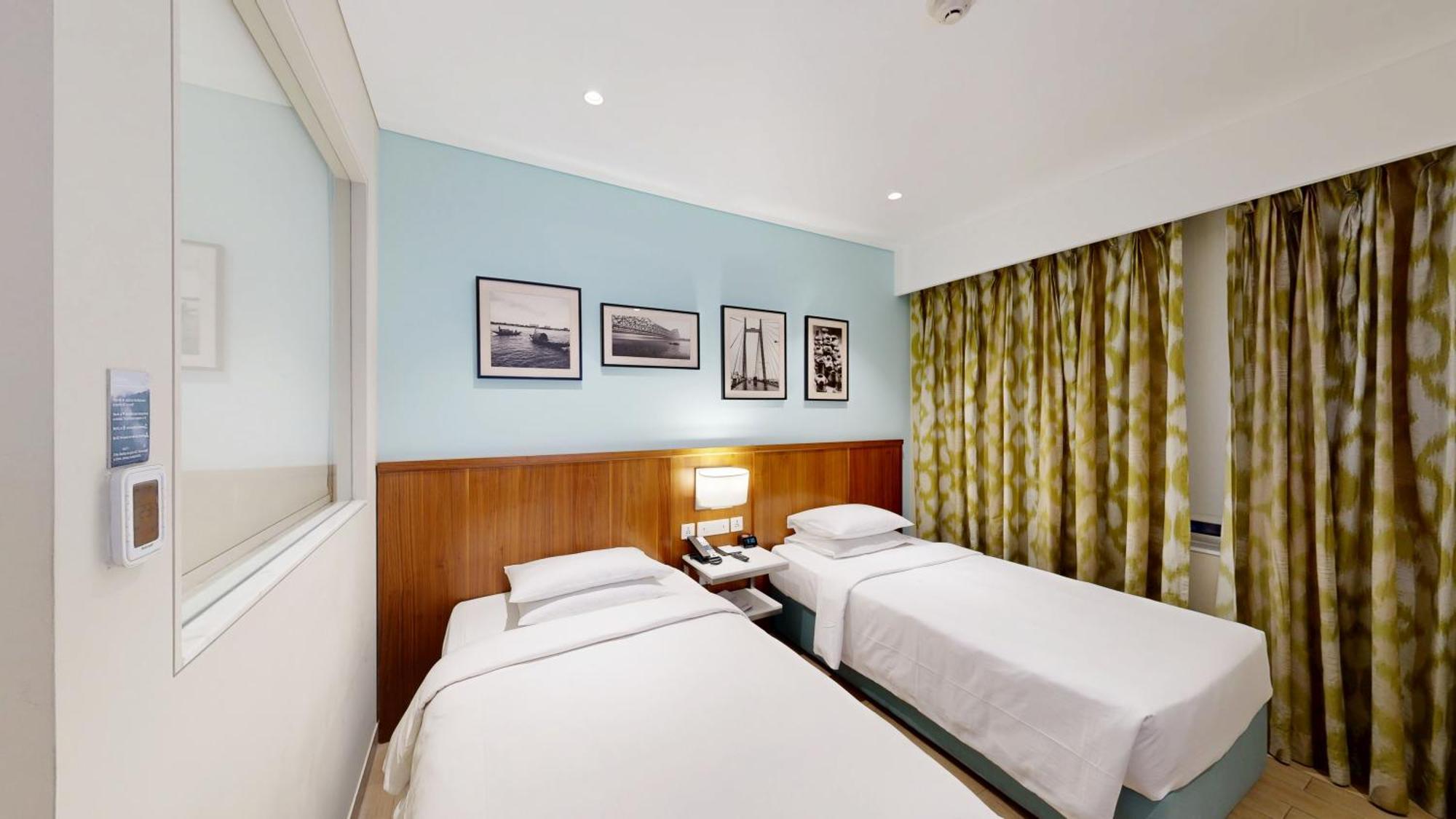 Executive Twin Room One-way airport transfer & INR 1000 Hotel Credit per Happy Hours 11 IMFL 4 PM to 8 PM at Vertex