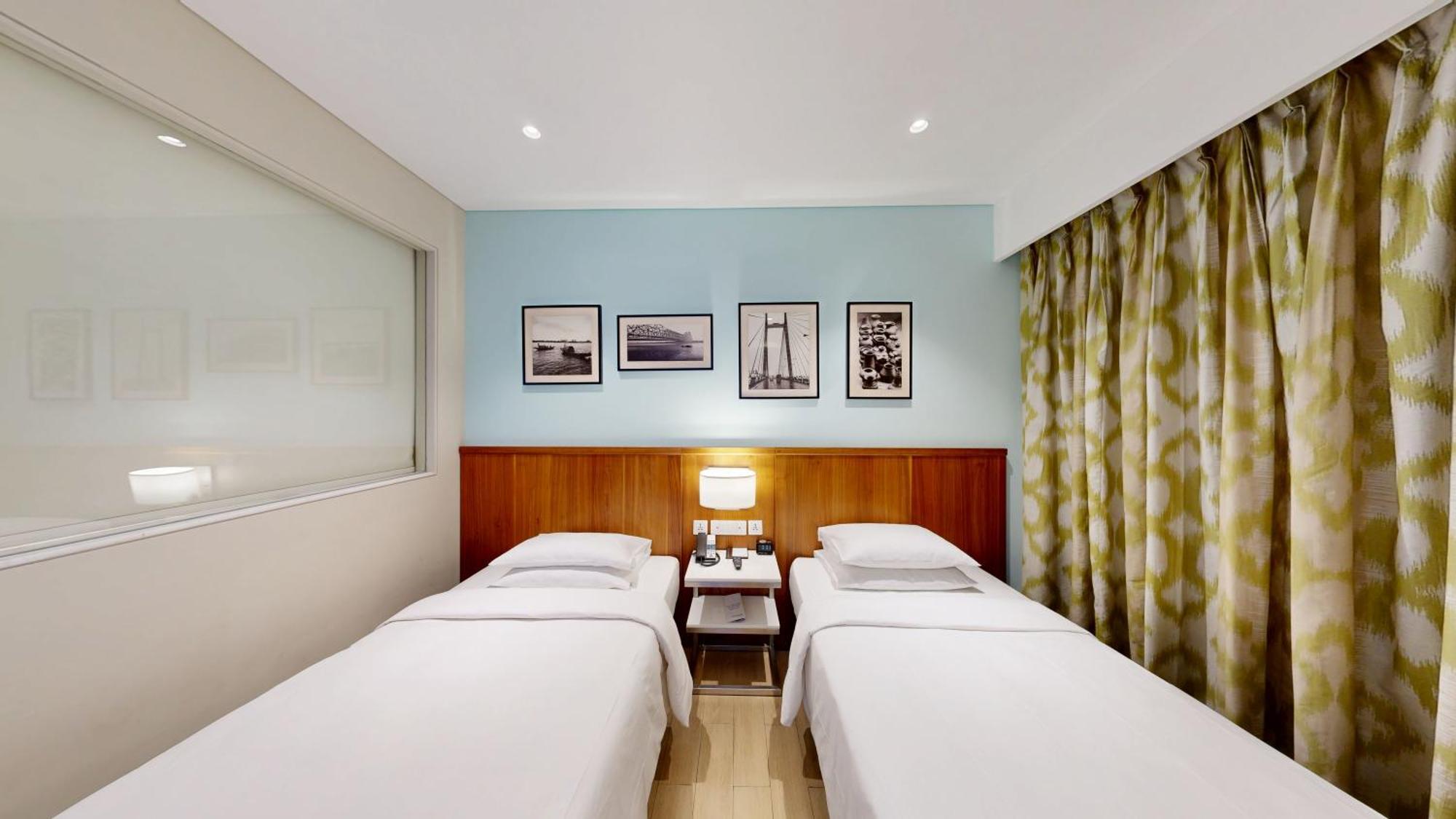 Executive Twin Room One-way airport transfer & INR 1000 Hotel Credit per Happy Hours 11 IMFL 4 PM to 8 PM at Vertex