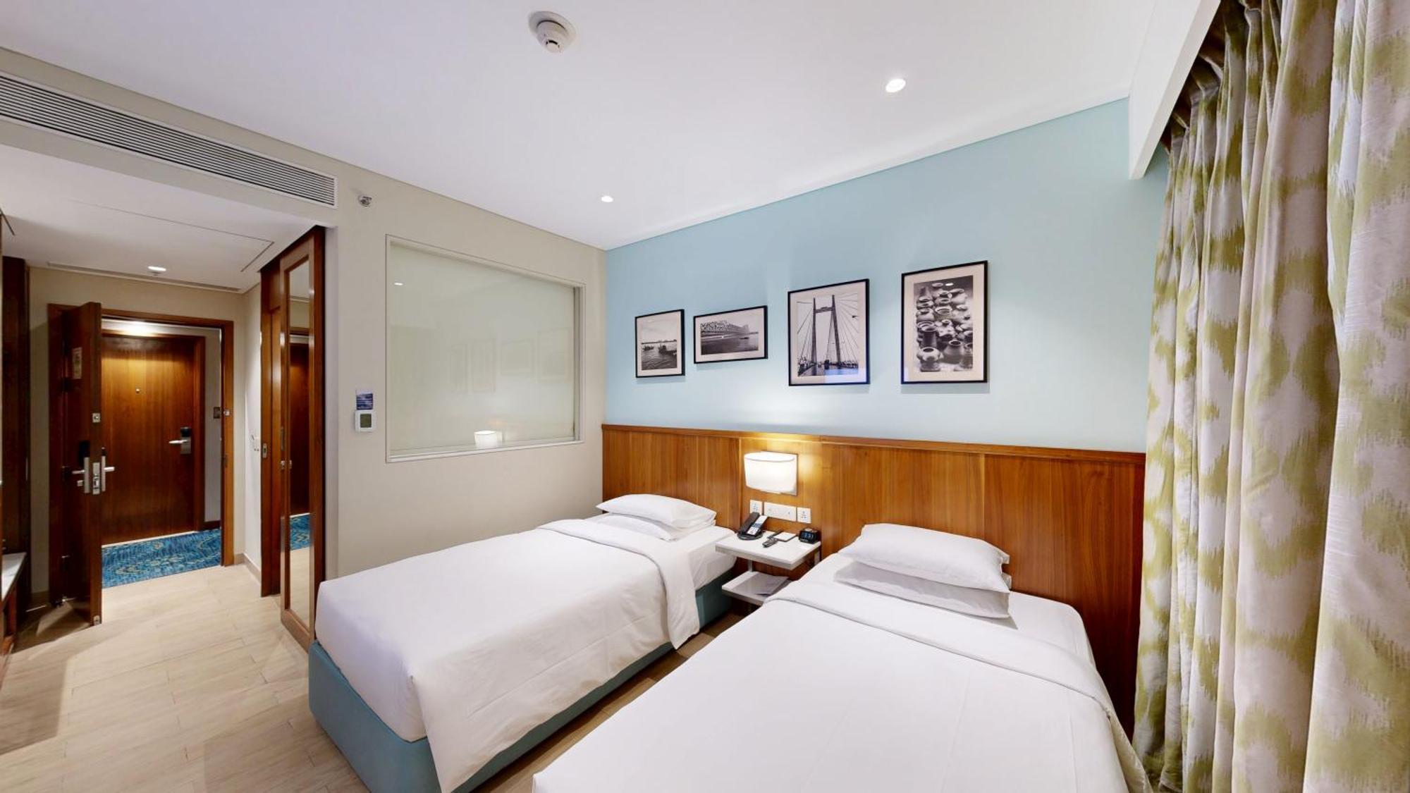 Executive Twin Room One-way airport transfer & INR 1000 Hotel Credit per Happy Hours 11 IMFL 4 PM to 8 PM at Vertex